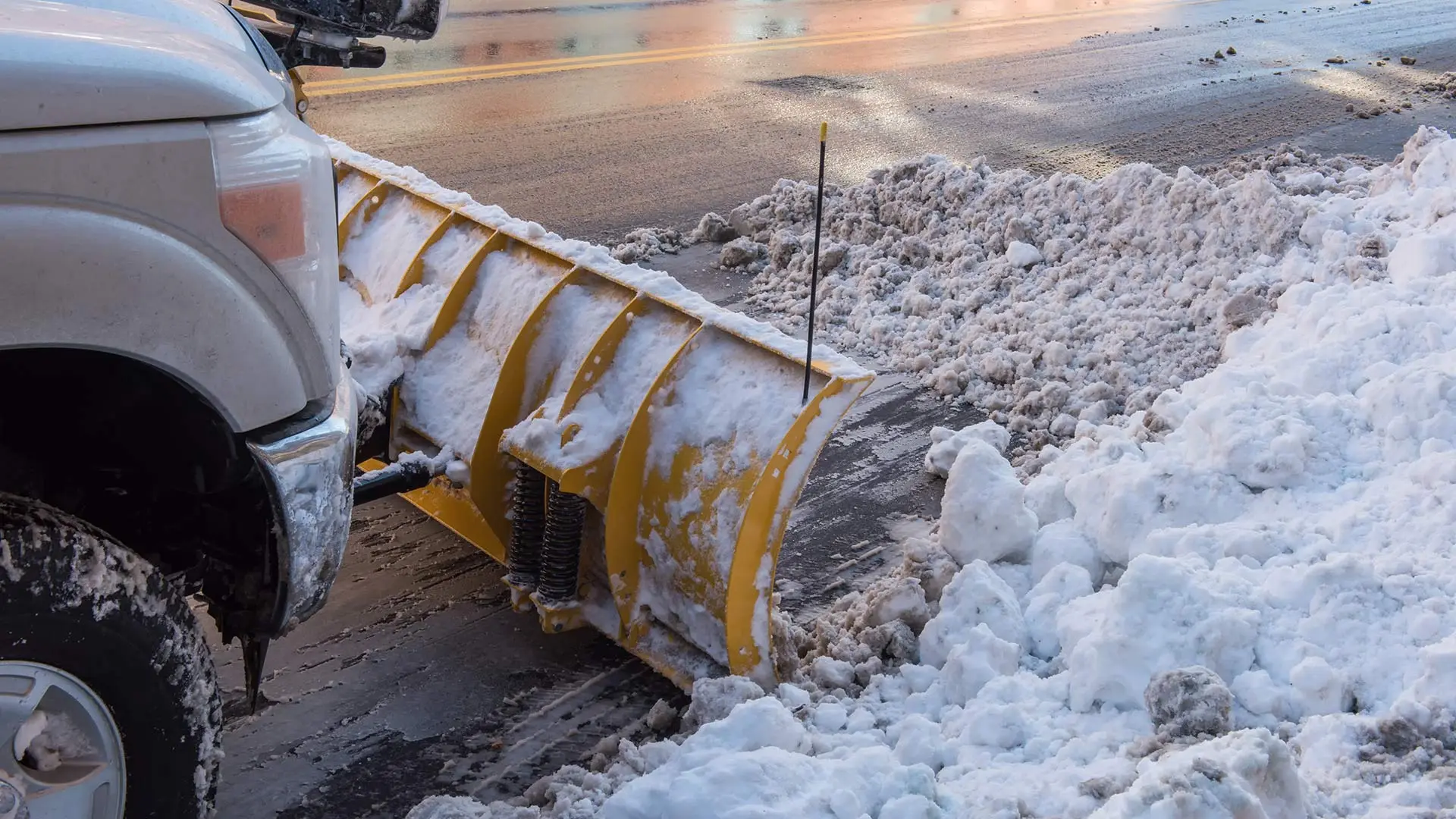 Commercial snow plow truck removing snow from streets in Kempton, PA.