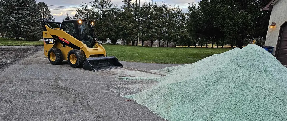 Snow piles after parking lot has been cleared by professionals.